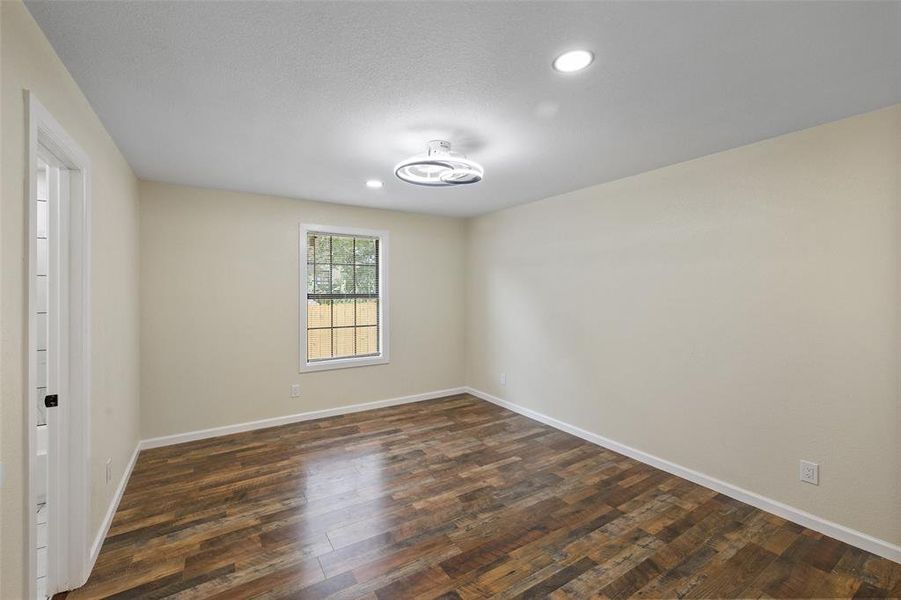 Spare room with hardwood / wood-style flooring