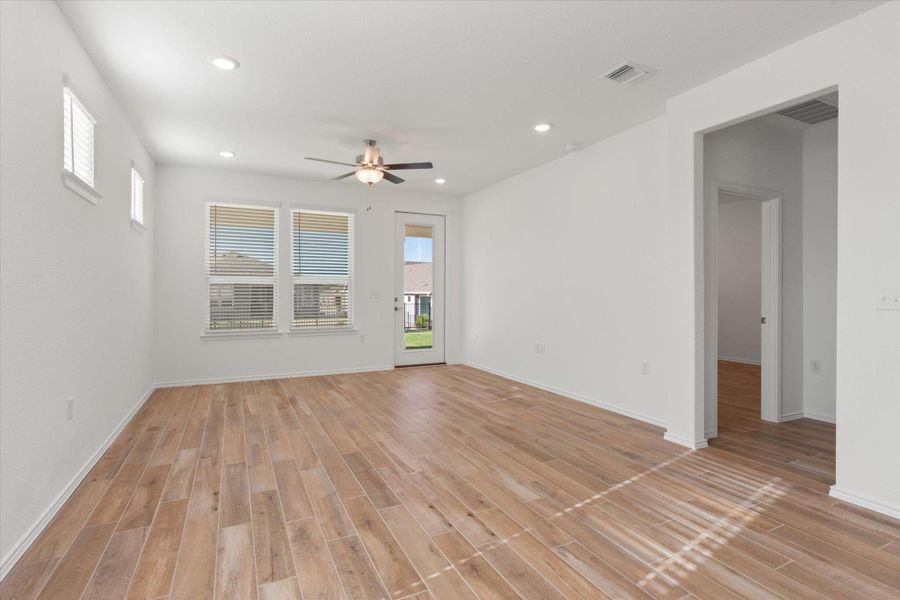 Empty room featuring plenty of natural light, recessed lighting, light wood-style floors, and ceiling fan
