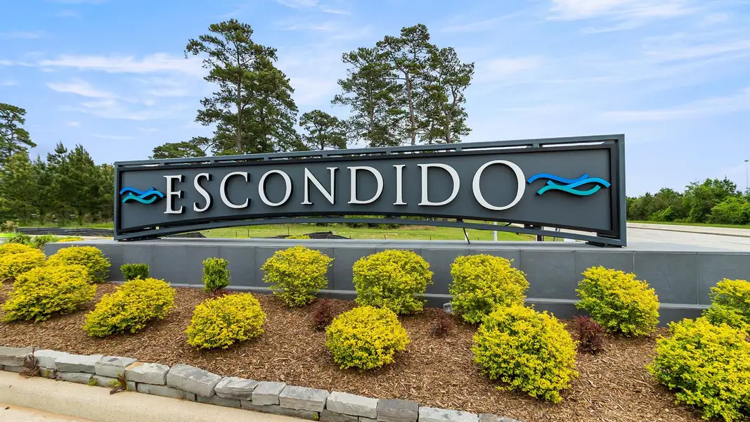 Front exterior of a new home in Escondido 45', Magnolia, TX, highlighting curb appeal (Image 2).