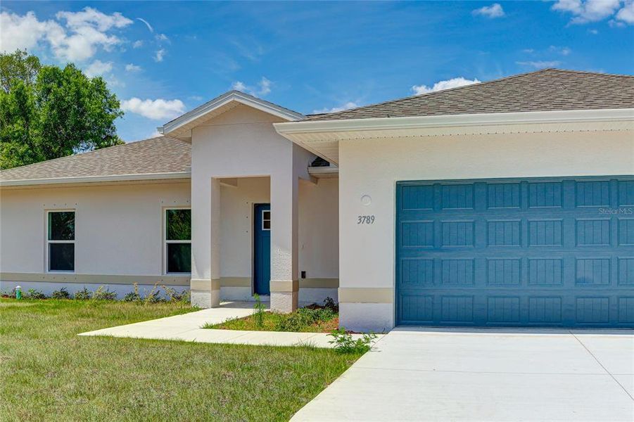 Front exterior of a new home in , North Port, FL, highlighting curb appeal (Image 25).