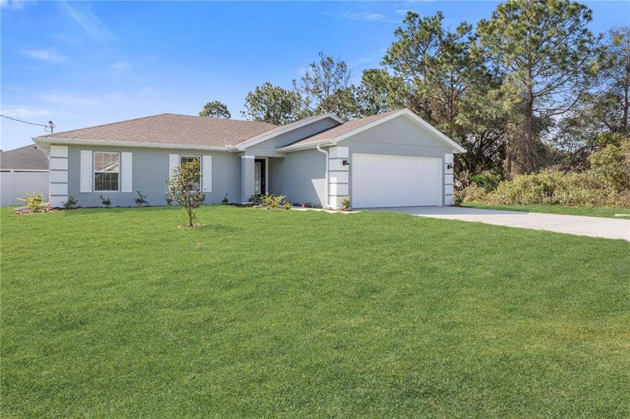 Front exterior of a new home in , Palm Coast, FL, highlighting curb appeal (Image 17).