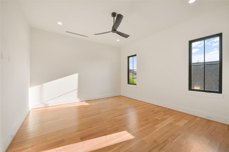 One of three secondary bedrooms on the second floor each featuring an ensuite bath and walk-in closet.