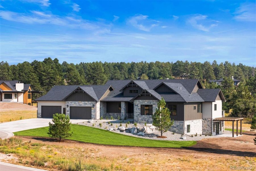 A brand-new ranch designed for connection with its setting - where refined living meets the beauty of Colorado outdoors.