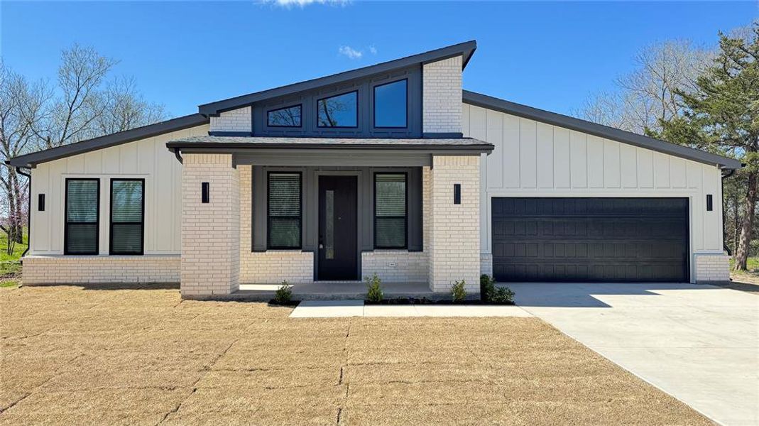 Front exterior of a new home in , Farmersville, TX, highlighting curb appeal (Image 25). Front exterior of a new home in , Farmersville, TX, highlighting curb appeal (Image 25).