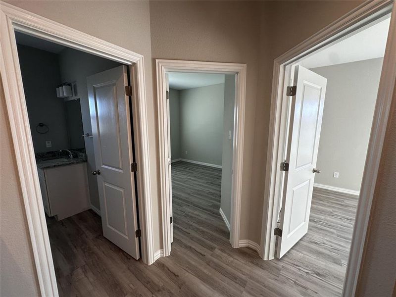 Corridor featuring hardwood / wood-style floors