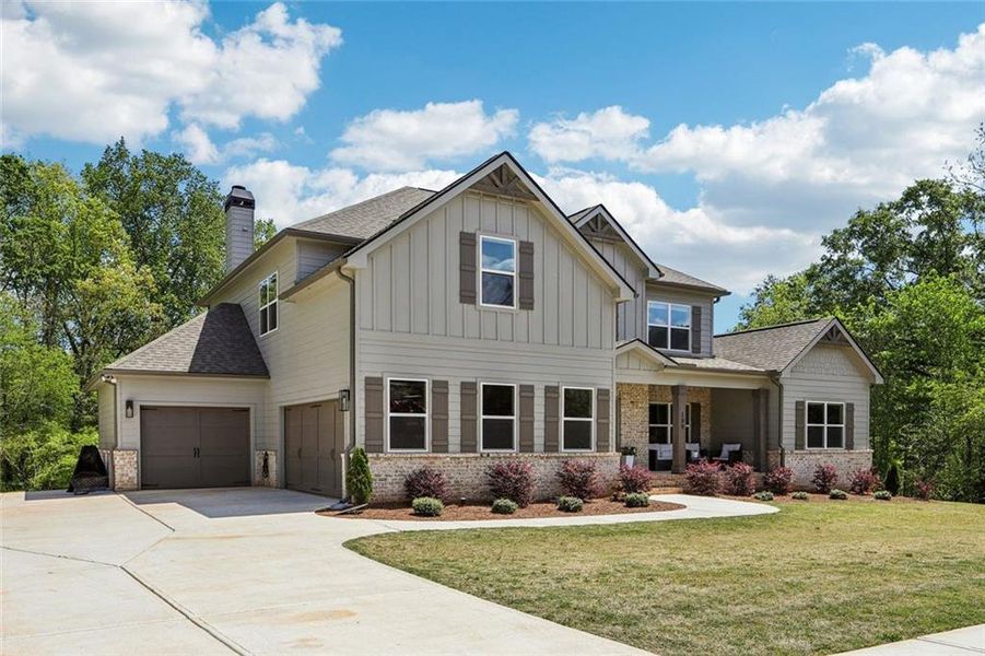 Front exterior of a new home in , Hoschton, GA, highlighting curb appeal (Image 27).