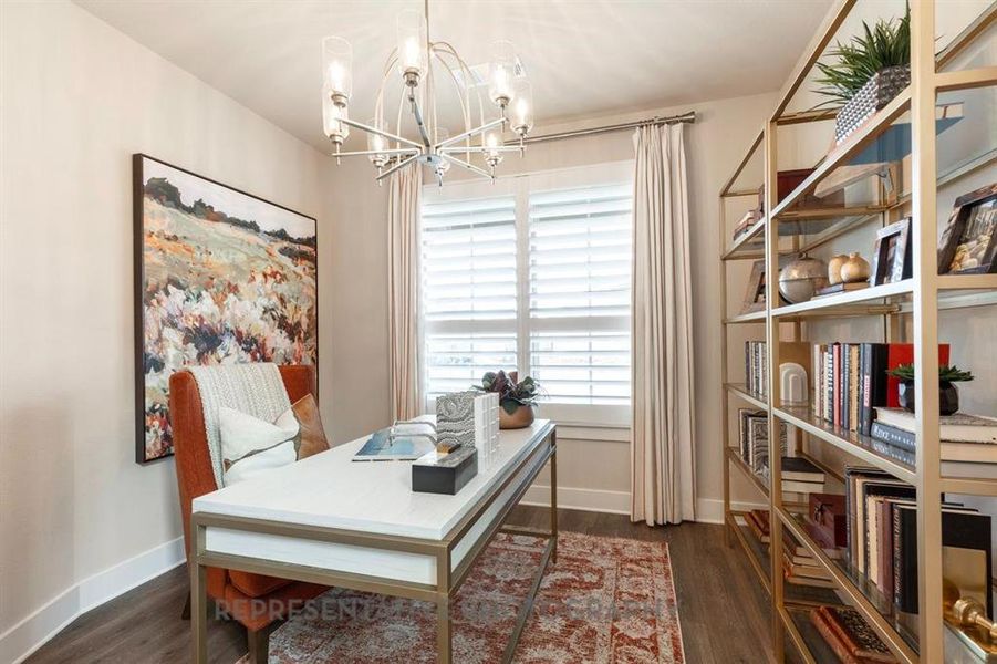 Office featuring dark wood-type flooring and a chandelier
