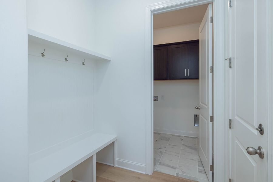 Mud room located off of the garage with plenty of storage