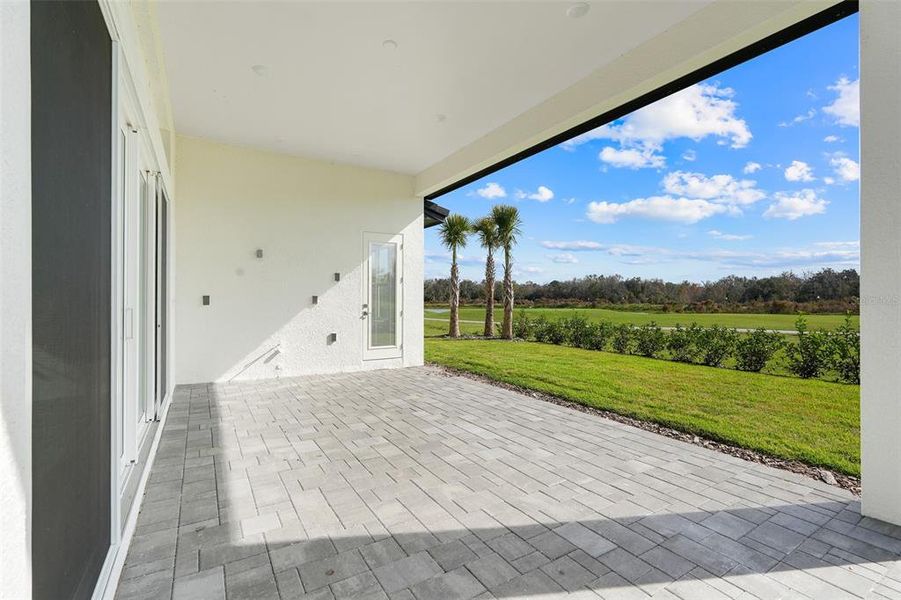 Exterior details and patio area of a home in Hampton Green at Providence, Davenport (Image 4).