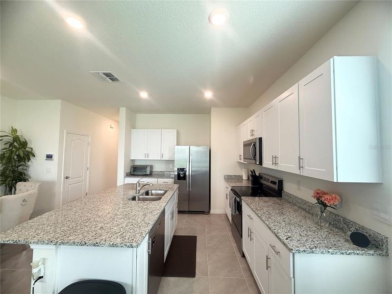 Furnished interior view inside a new home in , Kissimmee (Image 32).
