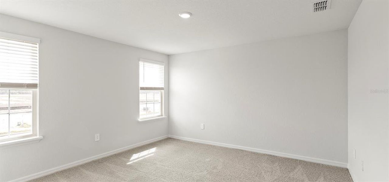 Spacious, unfurnished interior of a new home in Estates at Hickory Cove - Bungalows, St. Cloud (Image 14).