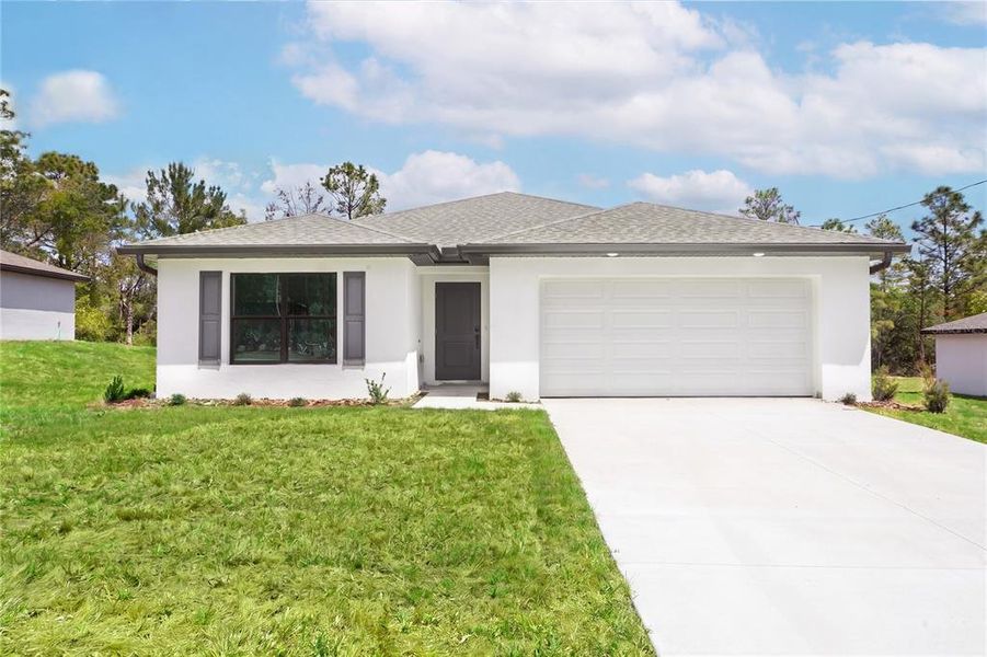 Front exterior of a new home in , Citrus Springs, FL, highlighting curb appeal (Image 2). Front exterior of a new home in , Citrus Springs, FL, highlighting curb appeal (Image 2).
