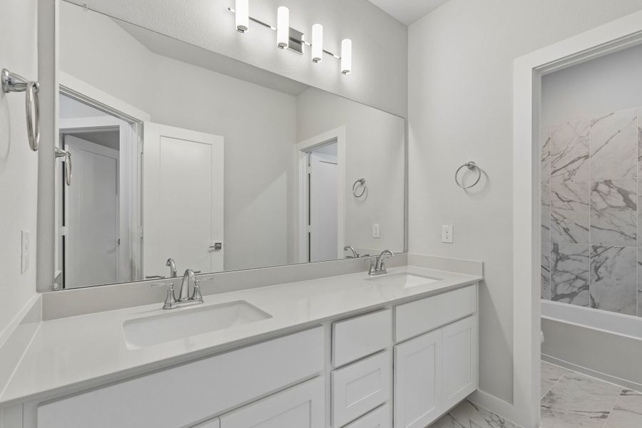 Bathroom in the Winters home plan by Trophy Signature Homes – REPRESENTATIVE PHOTO