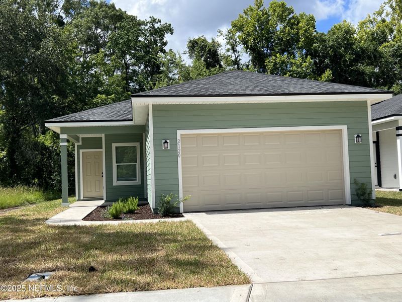 Front exterior of a new home in , Jacksonville, FL, highlighting curb appeal (Image 1).