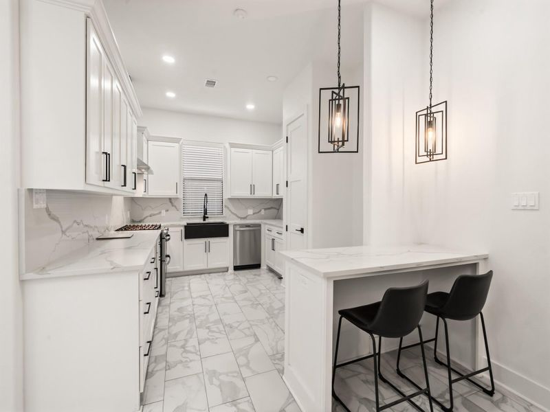 Kitchen fea. Niche Table with Quartz Counter Top, & Decreative Ceiling Light Fixture