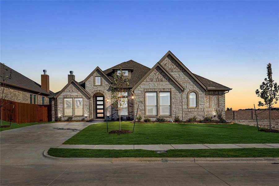 Front exterior of a new home in Villages of Walnut Grove, Midlothian, TX, highlighting curb appeal (Image 1).