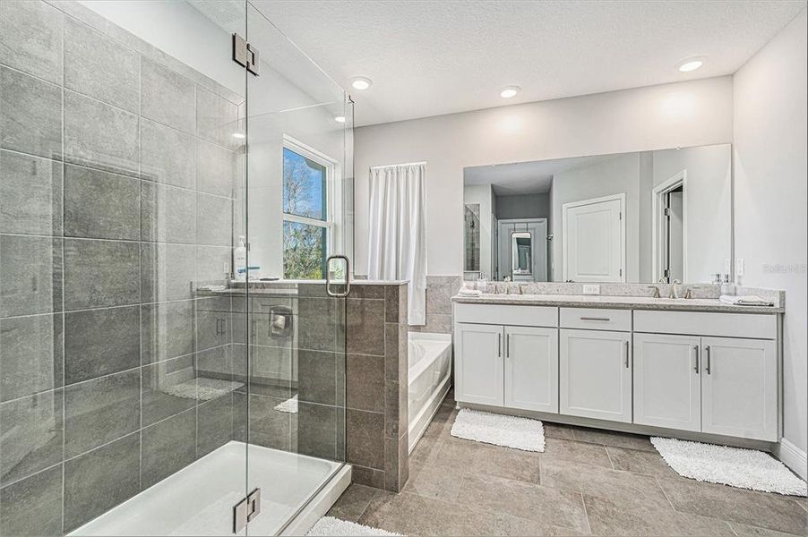 Large shower, separate tub, double sink