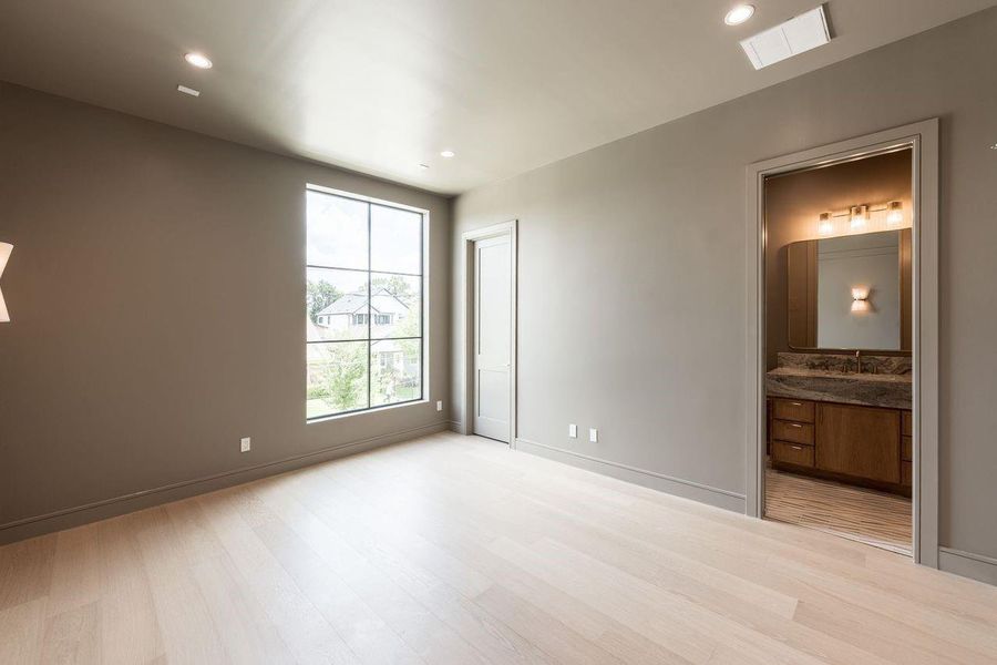 A moody, lounge-inspired game room designed for laid-back evenings and lively competition. Tailored wall paneling, ambient sconces, and a sleek billiards table set the stage for refined entertainment with just the right edge.