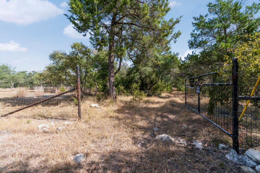 This is a TO BE BUILT custom home on 6.75 acres in Rainbow Ranch, Wimberley TX.