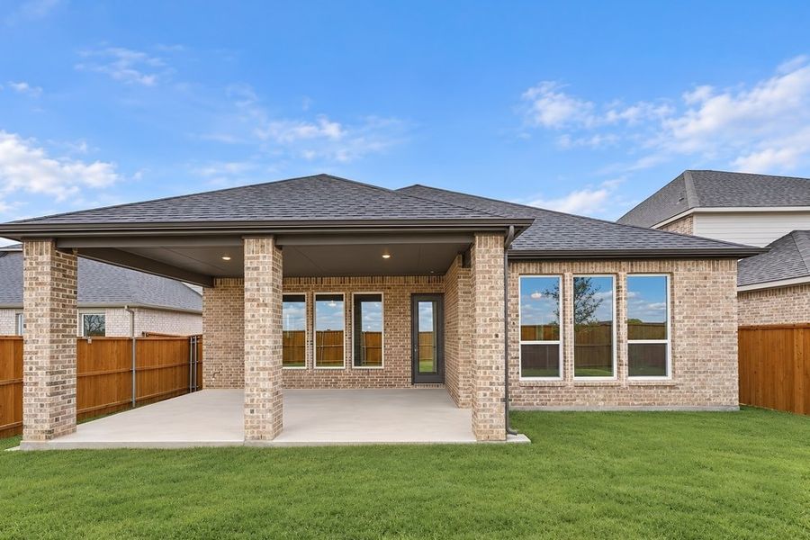 Exterior details and patio area of a home in South Oak, Lakewood Village (Image 19).