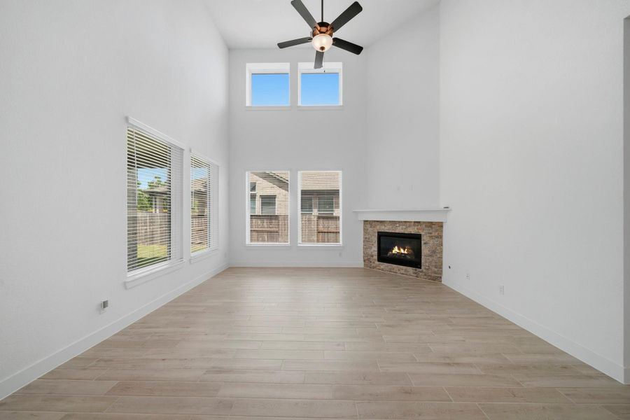You'll love cozying up by the fireplace, complete with a stone surround and white mantle.