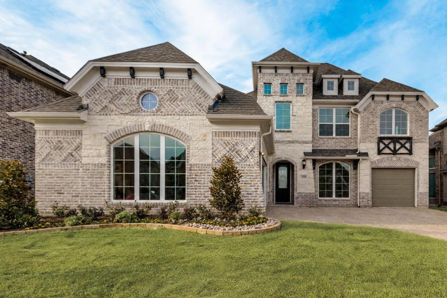 Representative exterior photo of a completed home built from the Hartford by Grand Homes in Monterra, Fate, TX (Image 15).