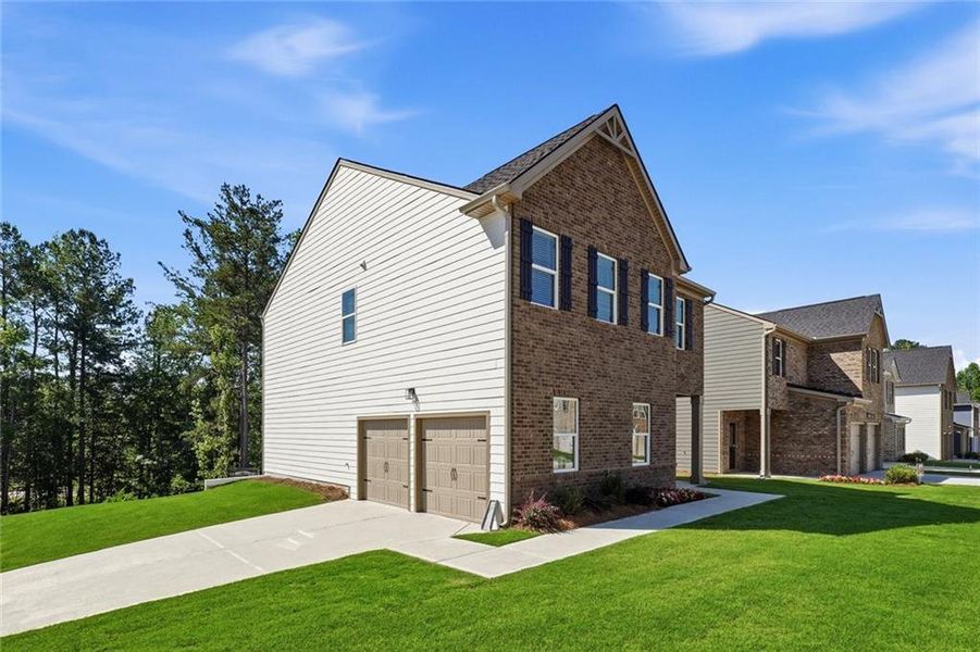 Front exterior of a new home in Creekbend Overlook, South Fulton, GA, highlighting curb appeal (Image 18).