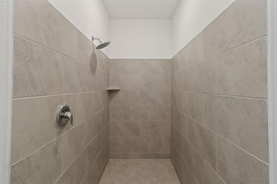 Full bath with tiled shower