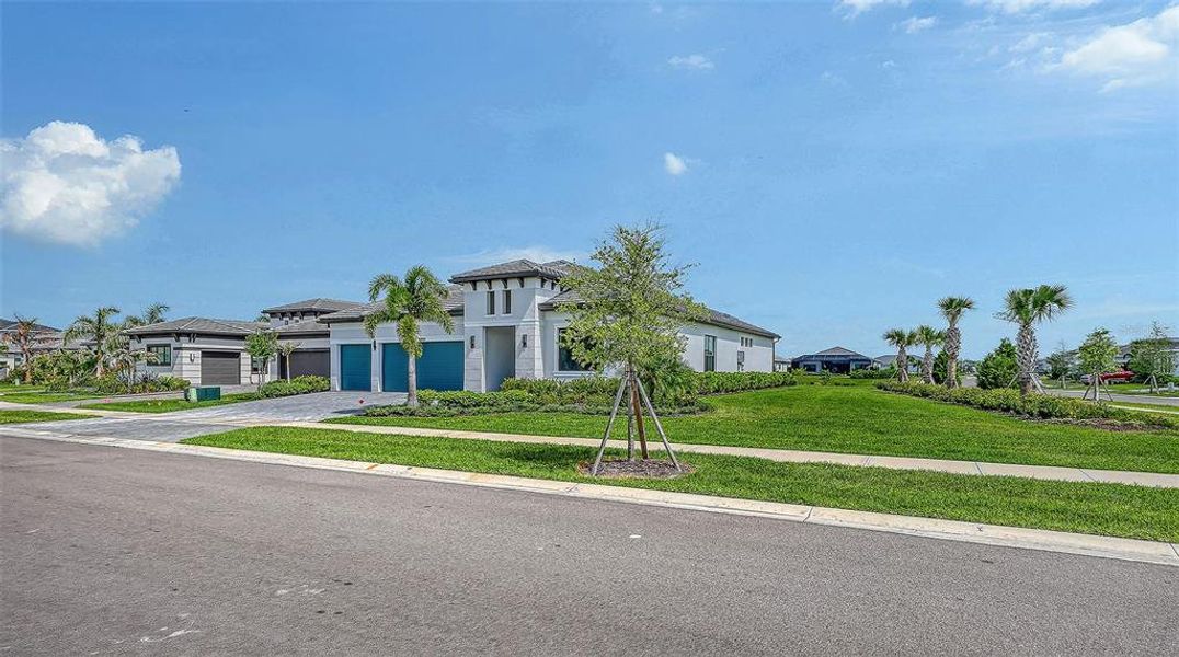Front exterior of a new home in , Sarasota, FL, highlighting curb appeal (Image 23).