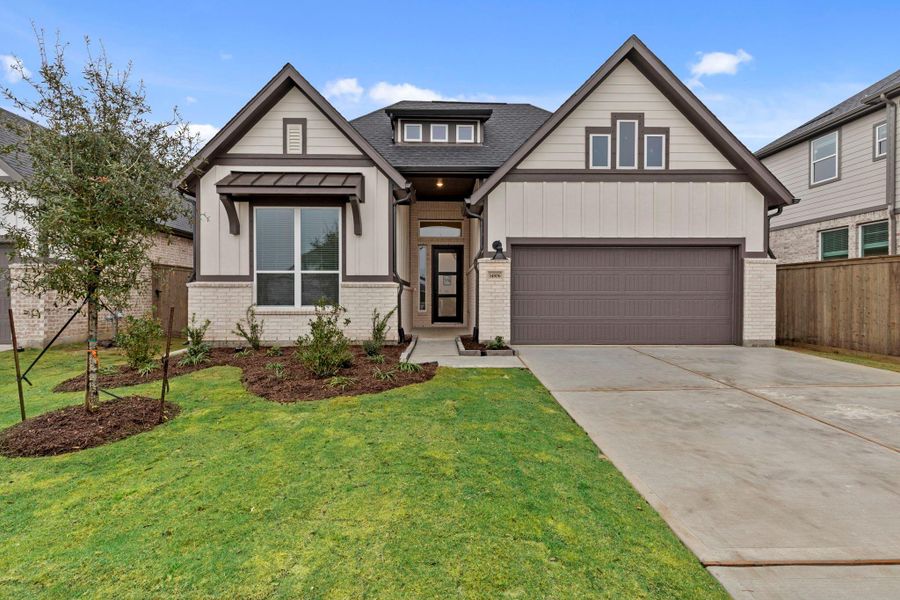 Front exterior of a new home in Blue Heron, Mont Belvieu, TX, highlighting curb appeal (Image 19).