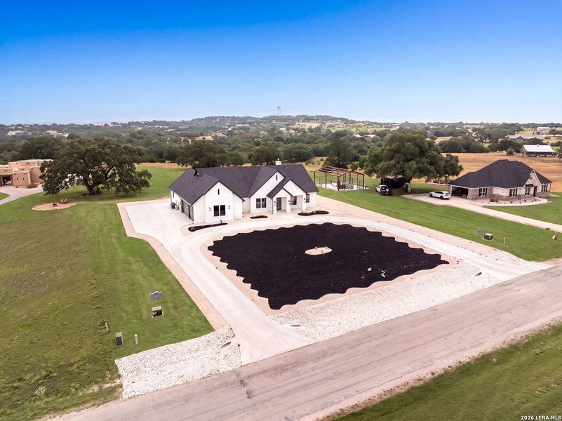Front exterior of a new home in , Bandera, TX, highlighting curb appeal (Image 2). Front exterior of a new home in , Bandera, TX, highlighting curb appeal (Image 2).