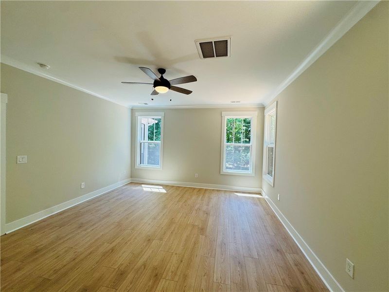 This airy room features durable flooring and ample