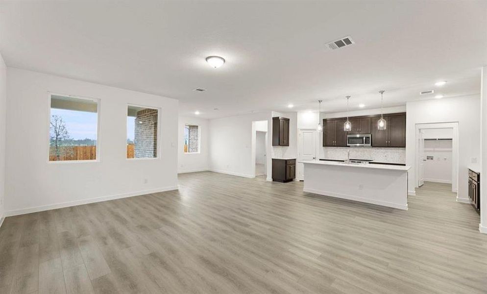 Open Kitchen-Living-Dining Room featuring the Roosevelt Collection