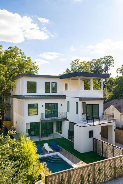 Striking contemporary architecture anchors this modern multi-level residence showcasing a private pool and integrated balconies. Striking contemporary architecture anchors this modern multi-level residence showcasing a private pool and integrated balconies.