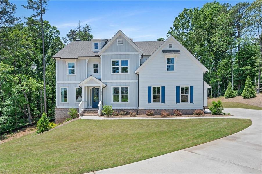 Front exterior of a new home in , Cumming, GA, highlighting curb appeal (Image 21).