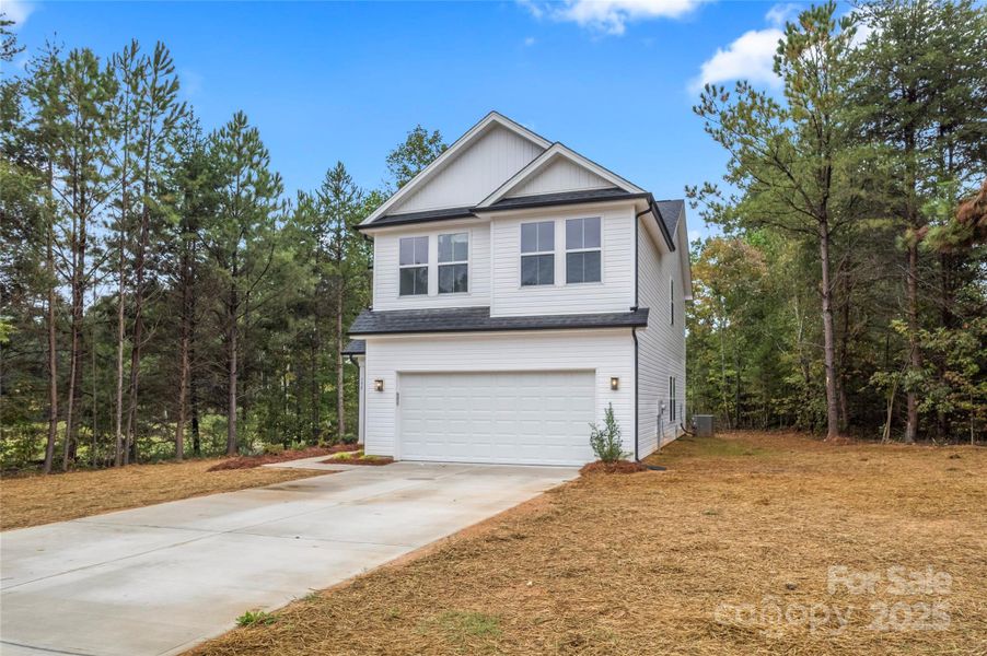 Front exterior of a new home in , Mooresville, NC, highlighting curb appeal (Image 2).
