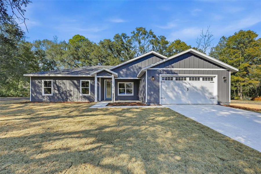 Front exterior of a new home in , Archer, FL, highlighting curb appeal (Image 17).