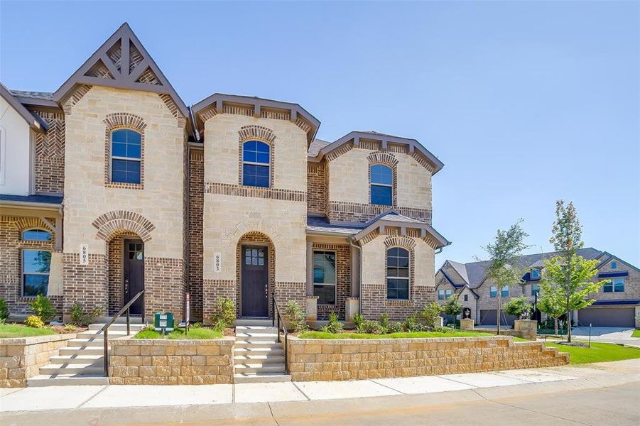 French country home with brick siding and stone siding French country home with brick siding and stone siding