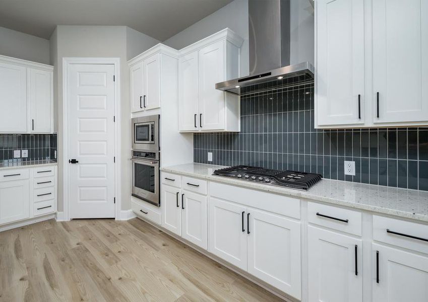 The white cabinets feature matte black hardware.