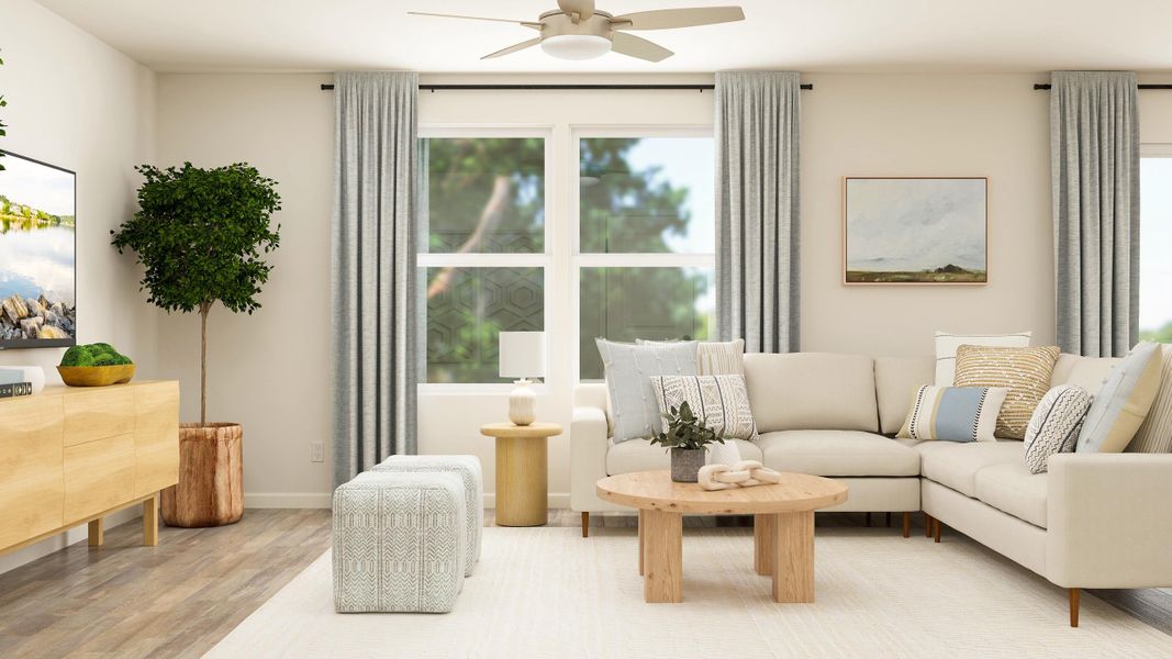 A living room with a white couch and a table. A living room with a white couch and a table.