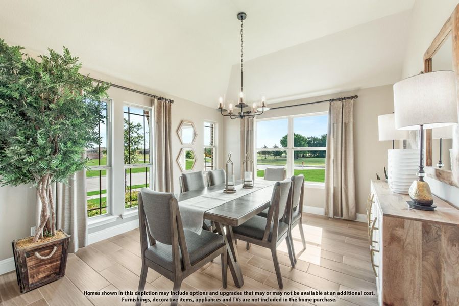 Dining room with six-chair table, chandelier, vaulted ceiling, and large windows with backyard views