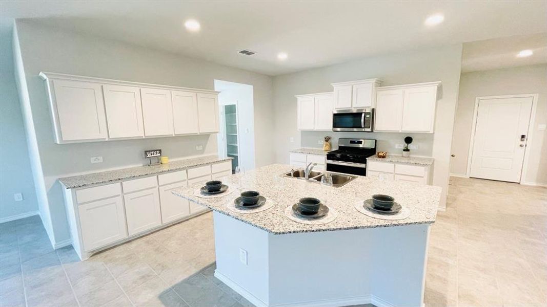 Kitchen - All Home and community information, including pricing, included features, terms, availability and amenities, are subject to change at any time without notice or obligation. All Drawings, pictures, photographs, video, square footages, floor plans, elevations, features, colors and sizes are approximate for illustration purposes only and will vary from the homes as built.