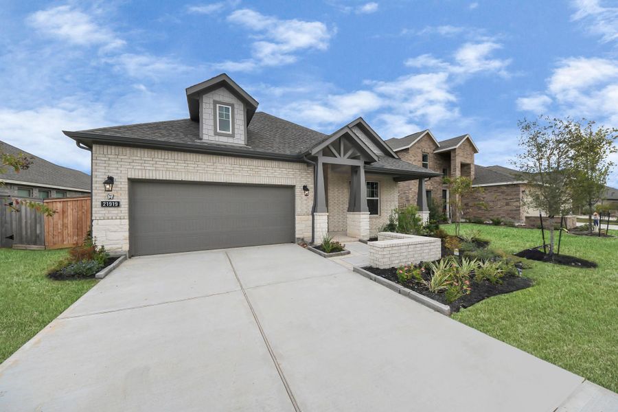 Front exterior of a new home in Bridgeland: Heritage Collection, Cypress, TX, highlighting curb appeal (Image 21).