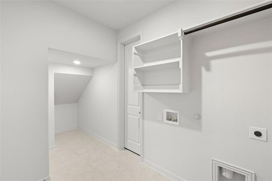 Laundry area with hookup for a washing machine, hookup for a gas dryer, and hookup for an electric dryer Laundry area with hookup for a washing machine, hookup for a gas dryer, and hookup for an electric dryer