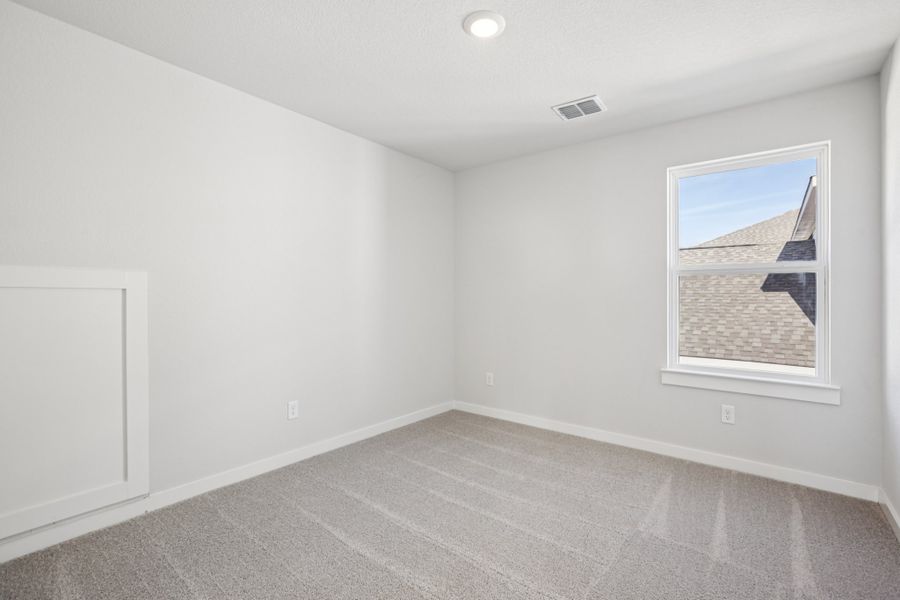 A room with a white wall and a white door.