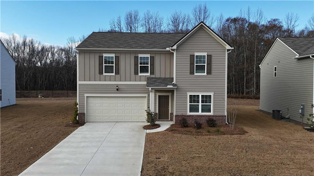 Front exterior of a new home in Casteel, Bethlehem, GA, highlighting curb appeal (Image 1). Front exterior of a new home in Casteel, Bethlehem, GA, highlighting curb appeal (Image 1).