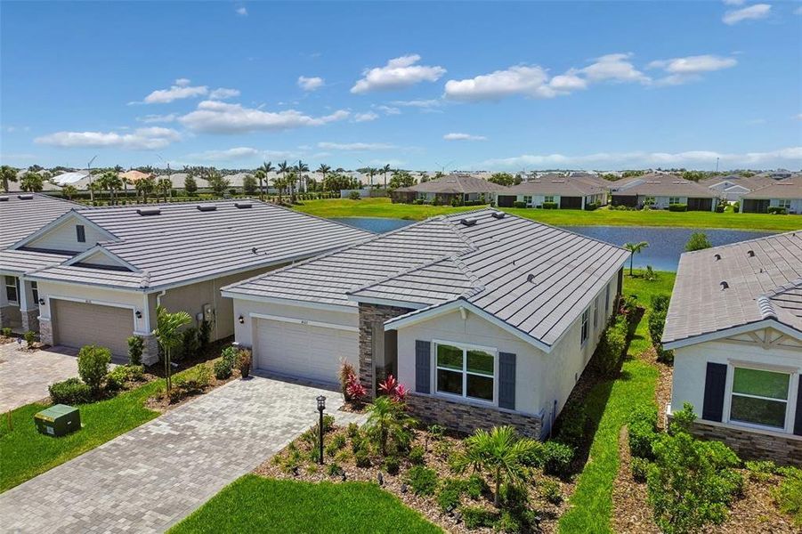 Front exterior of a new home in Star Farms at Lakewood Ranch, Bradenton, FL, highlighting curb appeal (Image 26).
