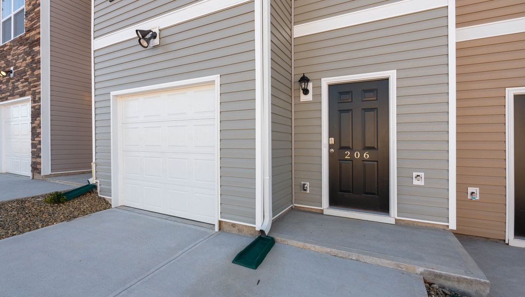 Exterior details and patio area of a home in Brookside Ridge Townhomes, Greer (Image 2).