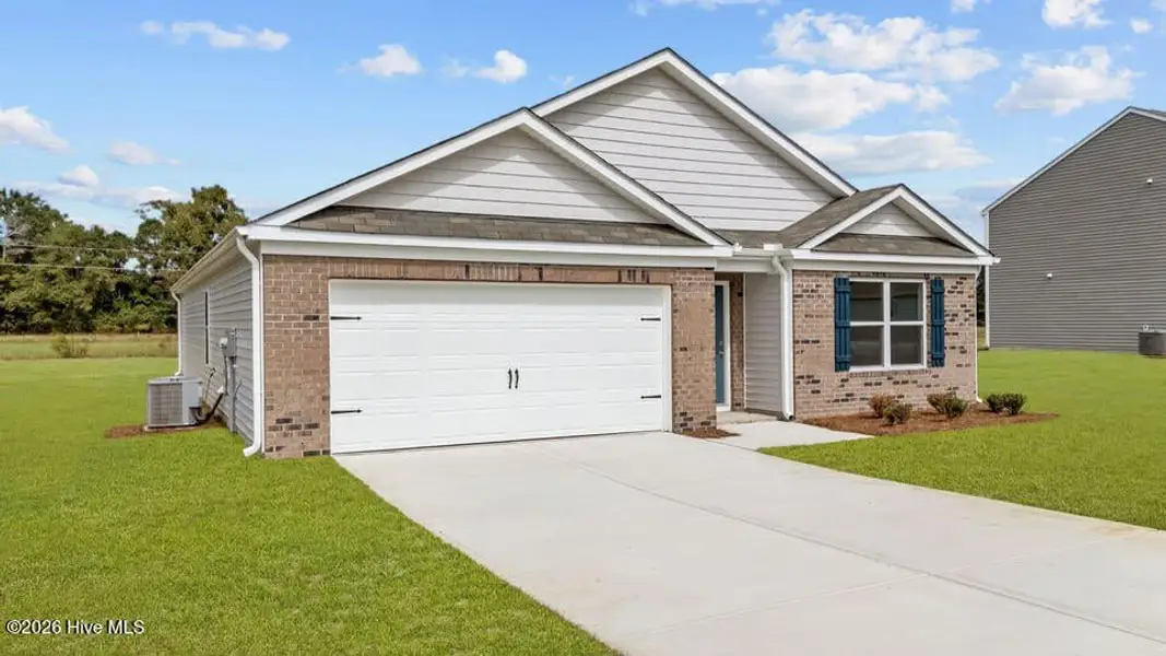 Front exterior of a new home in Carter Ridge, Greenville, NC, highlighting curb appeal (Image 2). Front exterior of a new home in Carter Ridge, Greenville, NC, highlighting curb appeal (Image 2).