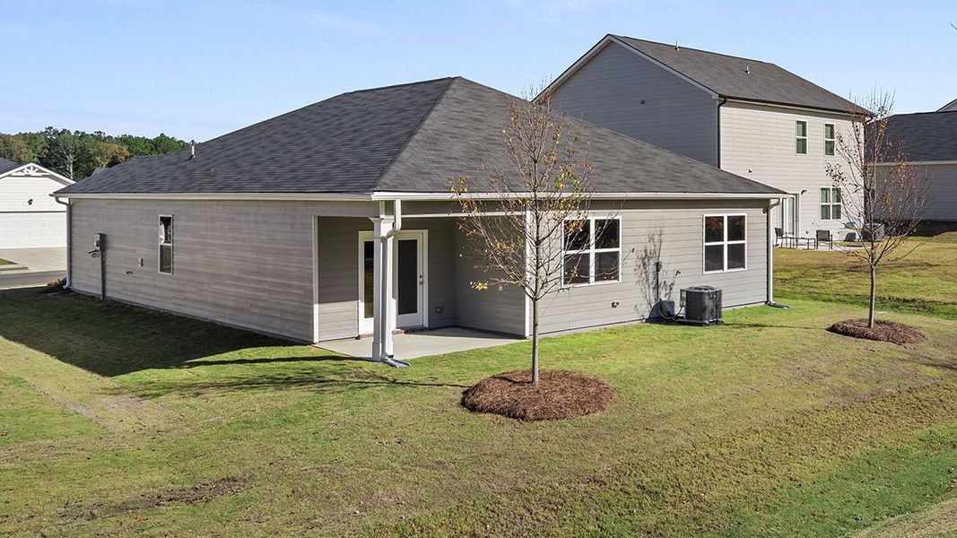 Exterior details and patio area of a home in Champion's Run, Lithonia (Image 19).